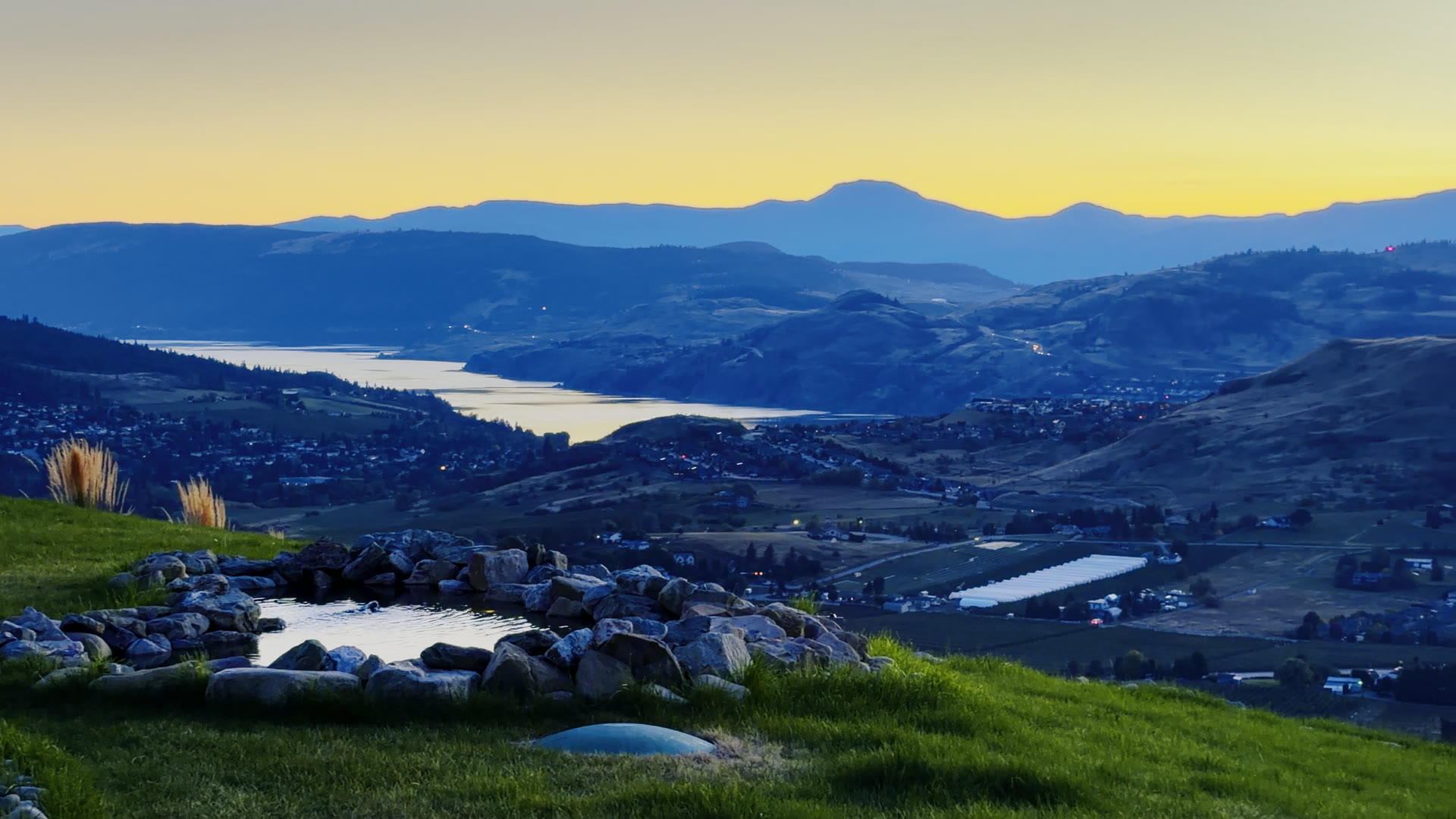 Kalamalka Lake and the hills at sunset, seen over the rock garden
